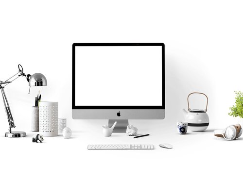Man adjusting monitor brightness and distance at his home office desk